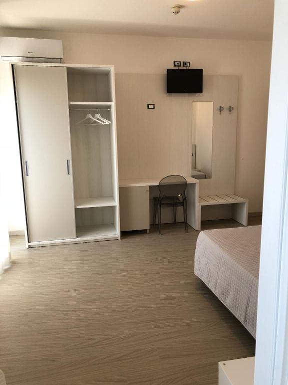 Postel nebo postele na pokoji v ubytování Hotel Portofino