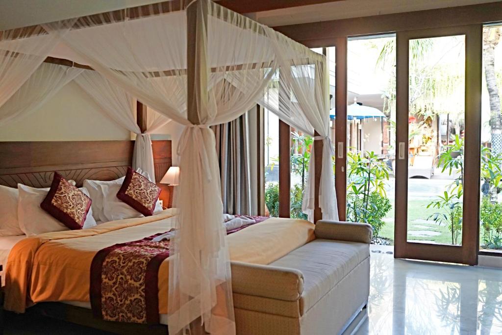 Postel nebo postele na pokoji v ubytování Lebak Bali Residence