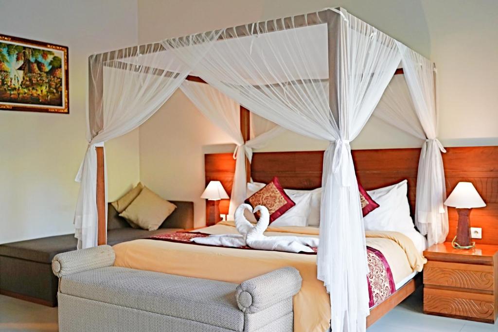 Postel nebo postele na pokoji v ubytování Lebak Bali Residence