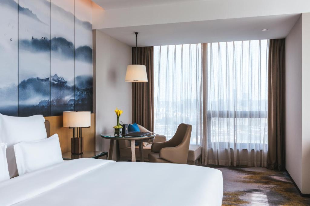 Postel nebo postele na pokoji v ubytování Pullman Fuzhou Tahoe