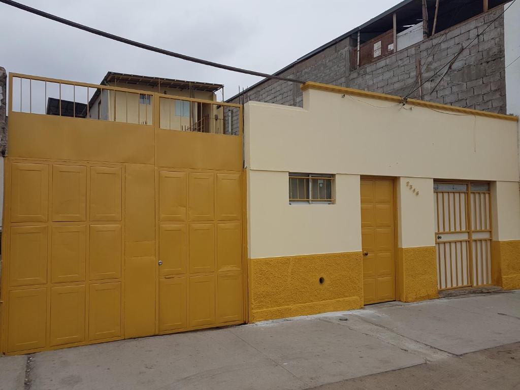 a pair of garage doors in front of a building at Resivic II in Antofagasta