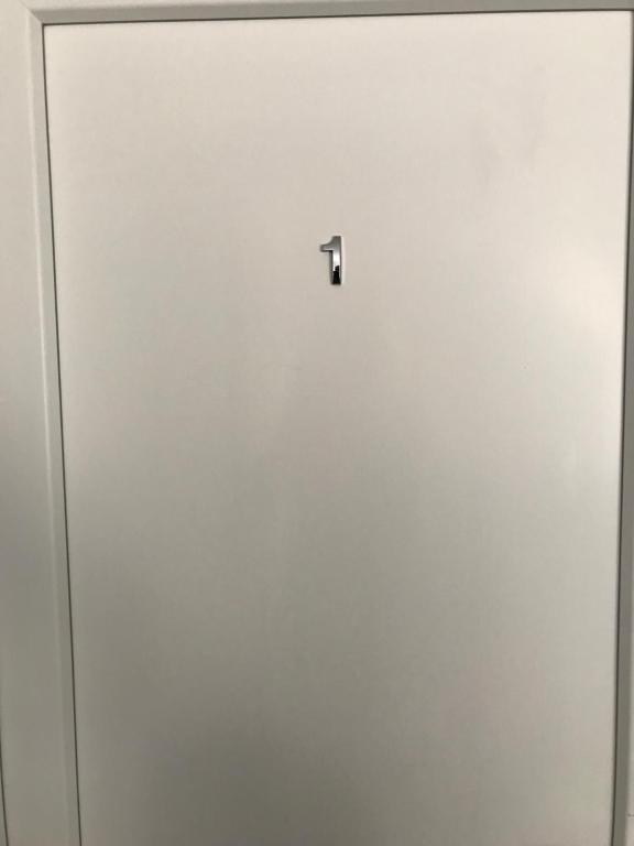 a white door with a lock on it at Vila de lux in Bela Crkva