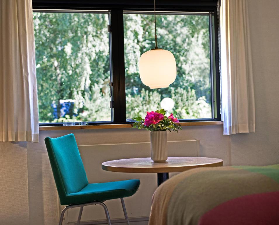 Postel nebo postele na pokoji v ubytování Kysthotellet