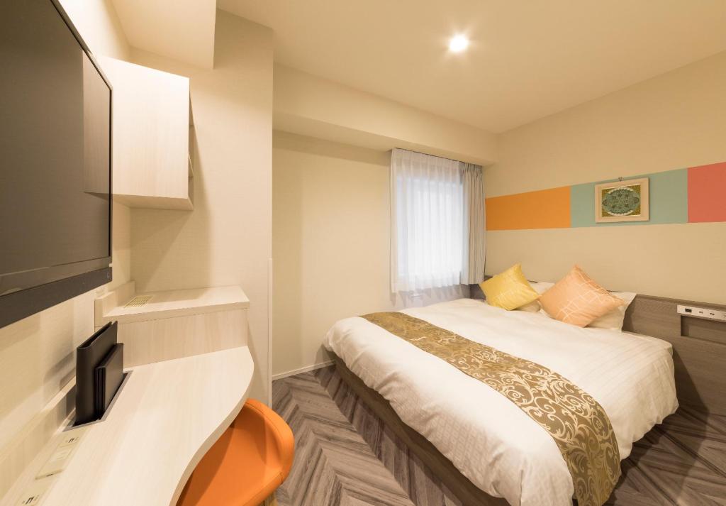 Postel nebo postele na pokoji v ubytování SARASA HOTEL Shin-Osaka