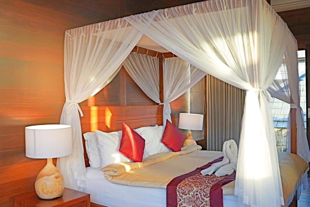 Postel nebo postele na pokoji v ubytování Lebak Bali Residence