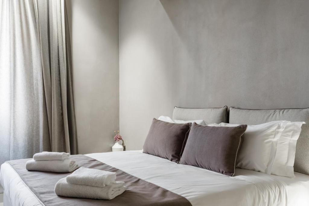 Posteľ alebo postele v izbe v ubytovaní Elysium Suites collection