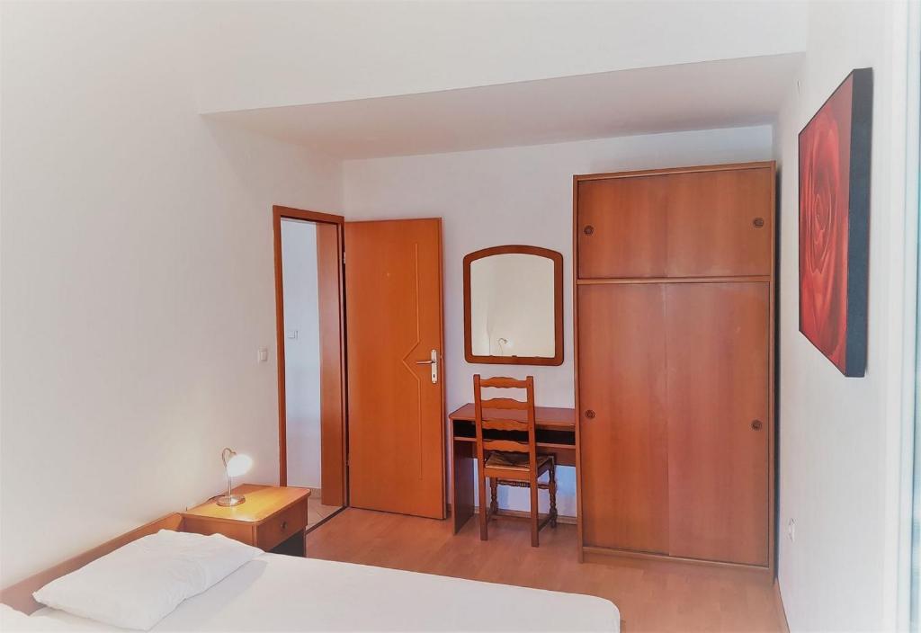 Postel nebo postele na pokoji v ubytování Apartments Vrtlici