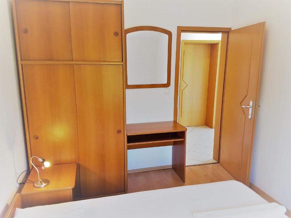 Postel nebo postele na pokoji v ubytování Apartments Vrtlici