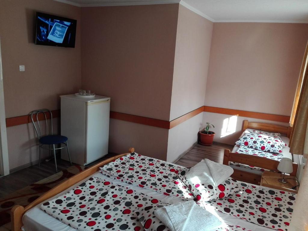 Postel nebo postele na pokoji v ubytování Hotel Tranzit