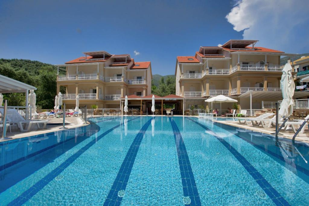a large swimming pool in front of a hotel at Elena Hotel in Parga