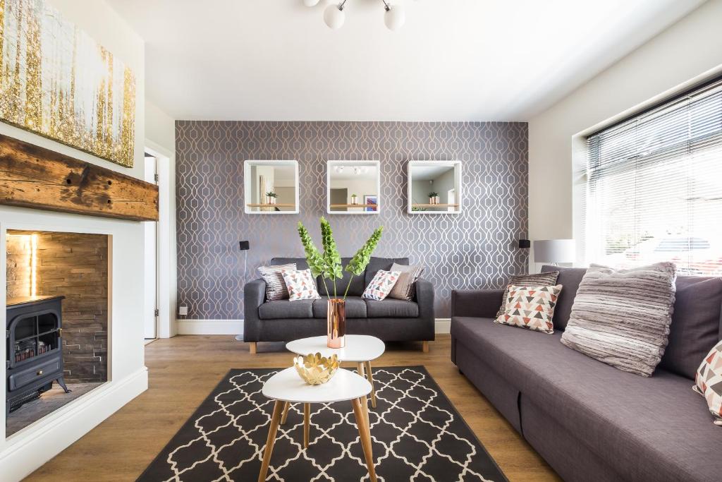 a living room with a couch and a fireplace at James Cook's Retreat in Middlesbrough