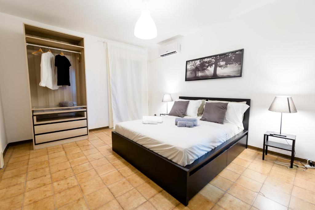 Postelja oz. postelje v sobi nastanitve City Center Apartments Catania