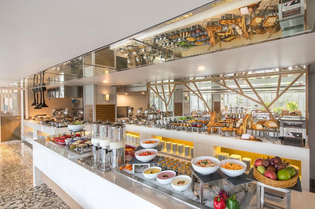 a buffet line with a lot of food at Eastin Ashta Resort Canggu in Canggu