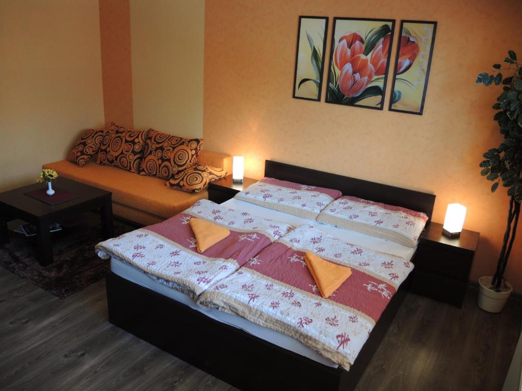 Postel nebo postele na pokoji v ubytování Apartmany Rudolf