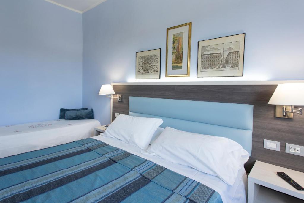 Posteľ alebo postele v izbe v ubytovaní Hotel Il Giardino