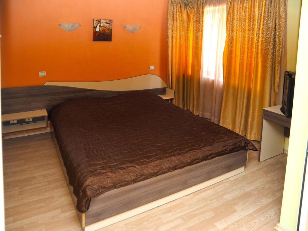 Postel nebo postele na pokoji v ubytování Eos Hotel
