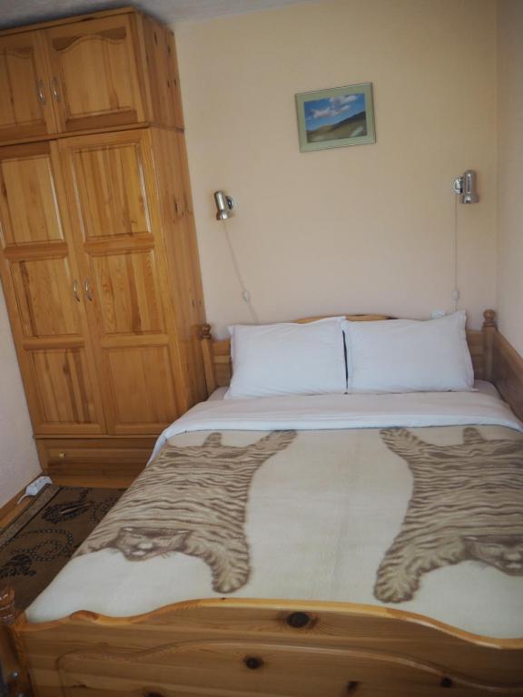 Postel nebo postele na pokoji v ubytování Орбелус