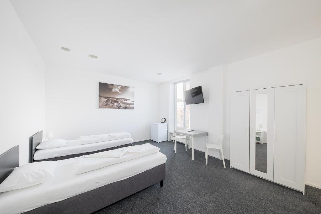 Postel nebo postele na pokoji v ubytování Hotel & Hostel Letov