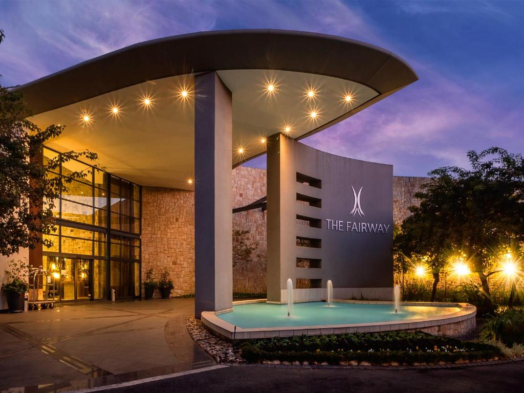 a building with a sign in front of it at The Fairway Hotel, Spa & Golf Resort in Johannesburg