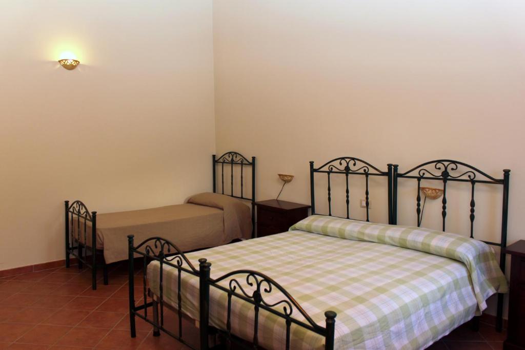 A bed or beds in a room at Masseria Mastrangelo