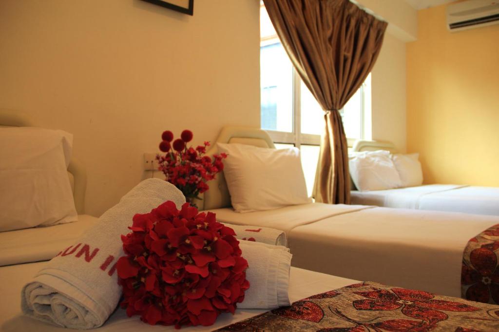 Katil atau katil-katil dalam bilik di Sun Inns Hotel Sitiawan