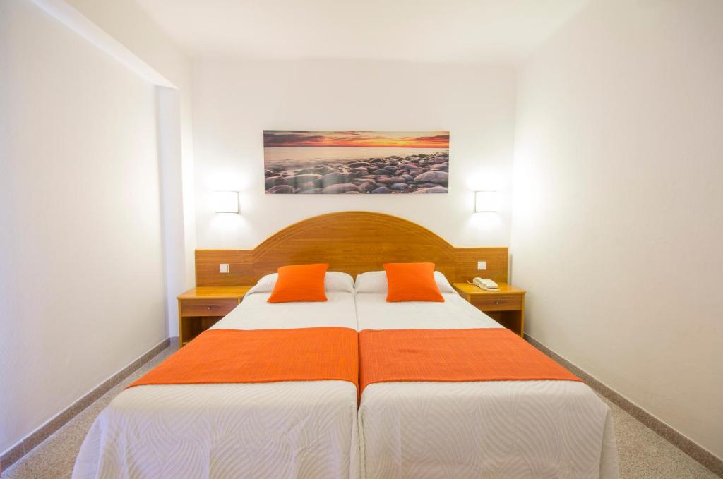 A bed or beds in a room at Hotel Brisa Ibiza - Adults only