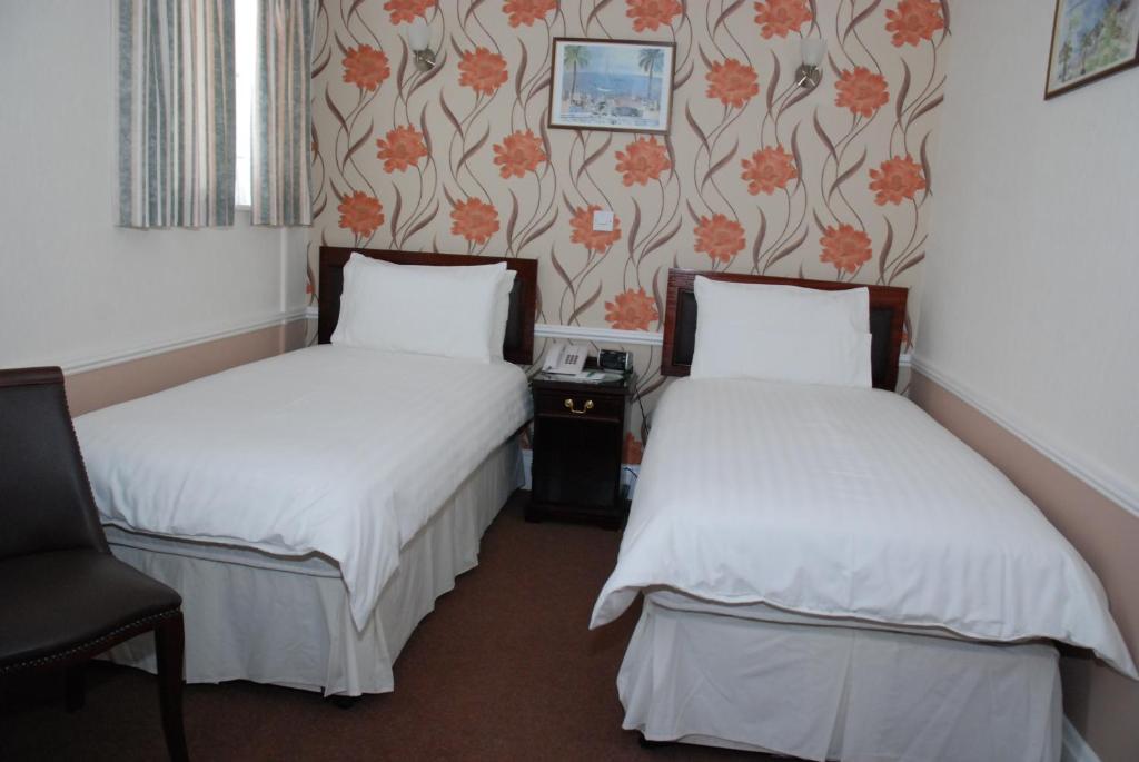 Postel nebo postele na pokoji v ubytování Pontac House Hotel