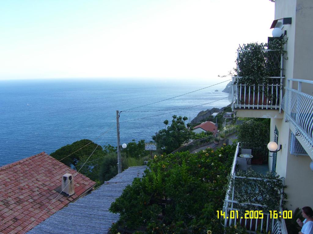 a view of the ocean from a building at Locanda Degli Agrumi in Conca dei Marini