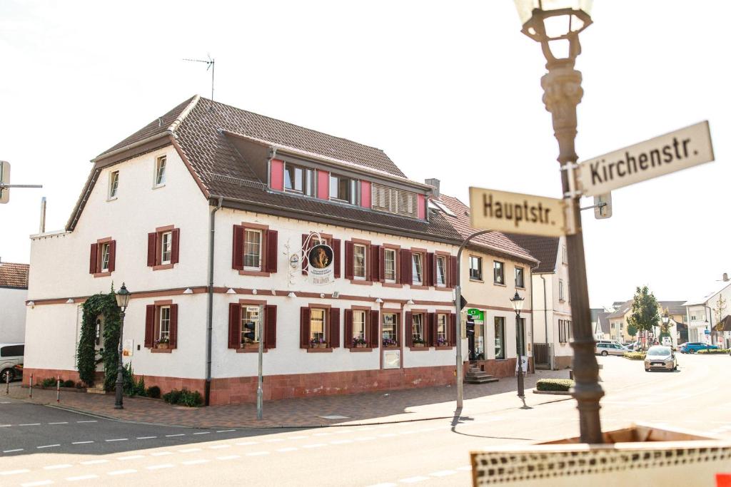 a building on the corner of a street at Hotel Löwen in Eggenstein-Leopoldshafen