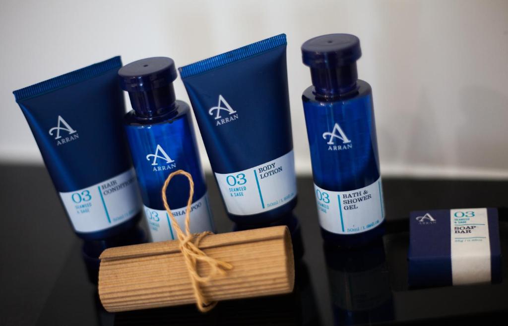 a group of three bottles of hair products on a table at Waterfront Southport Hotel in Southport