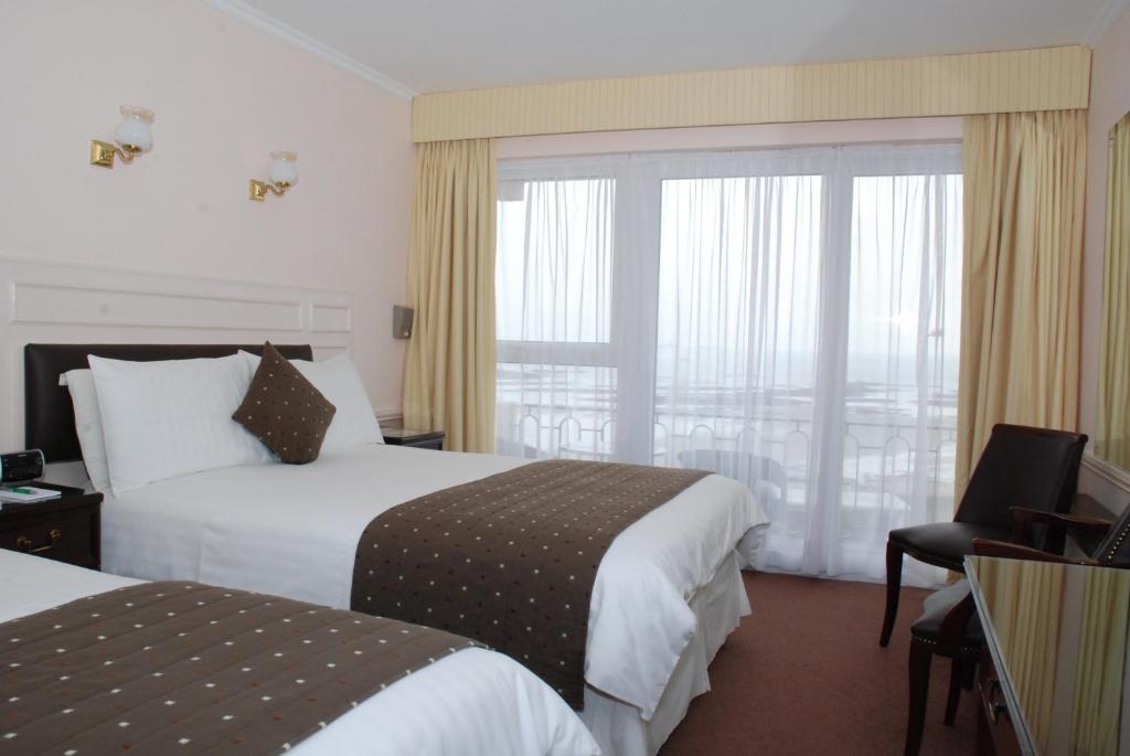 Postel nebo postele na pokoji v ubytování Pontac House Hotel
