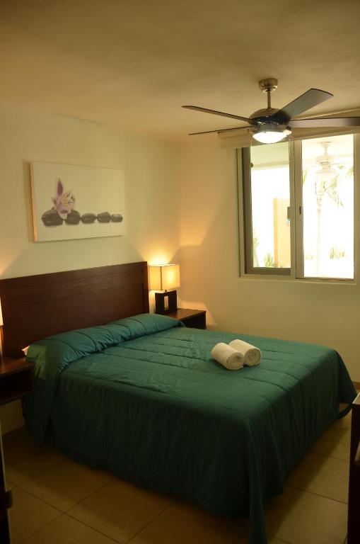 Postel nebo postele na pokoji v ubytování Zenharmony Suites