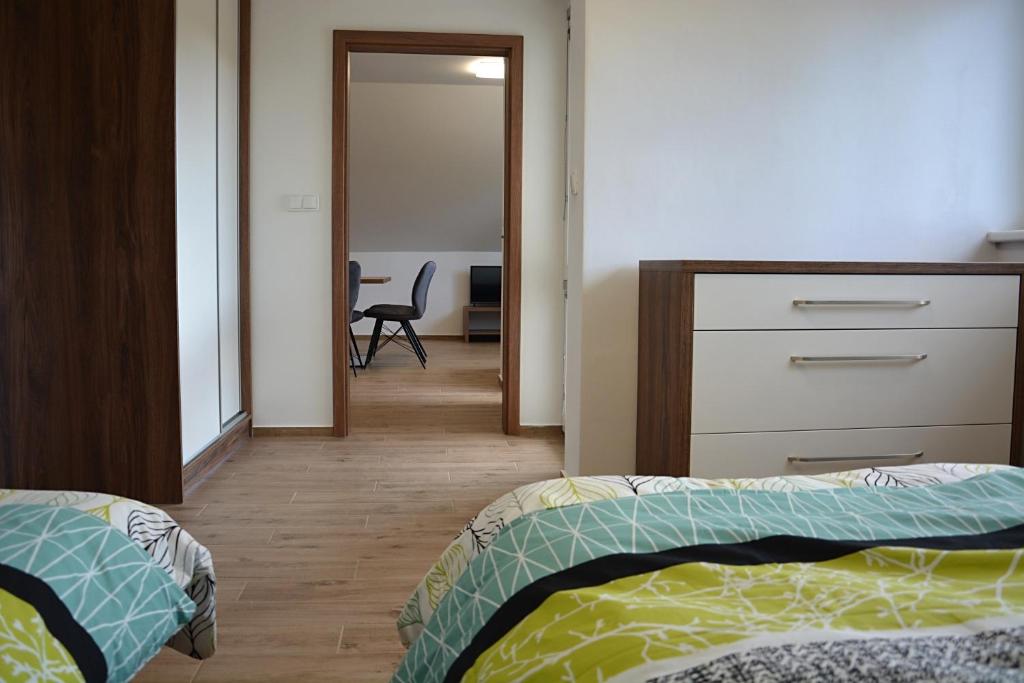Postel nebo postele na pokoji v ubytování Na Zeleném statku