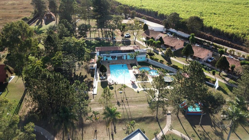 an aerial view of a house with a swimming pool at Hotel Marina Do Lago in Santa Cruz da Conceição
