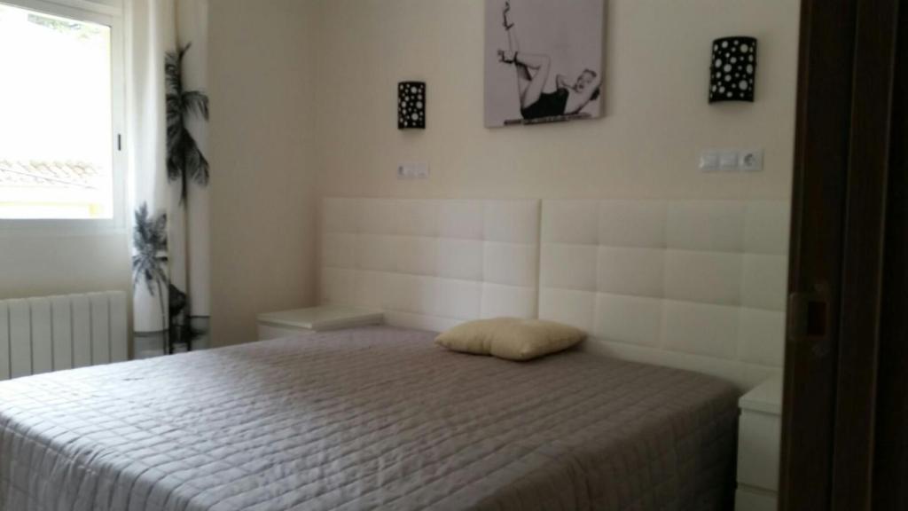 A bed or beds in a room at Villa Irena Denia