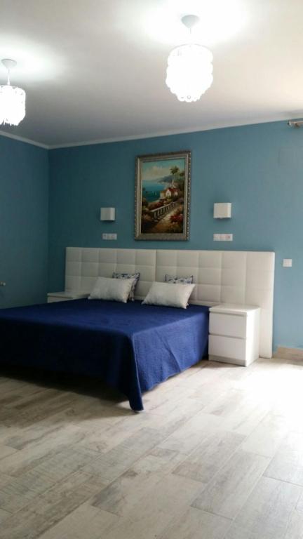 A bed or beds in a room at Villa Irena Denia
