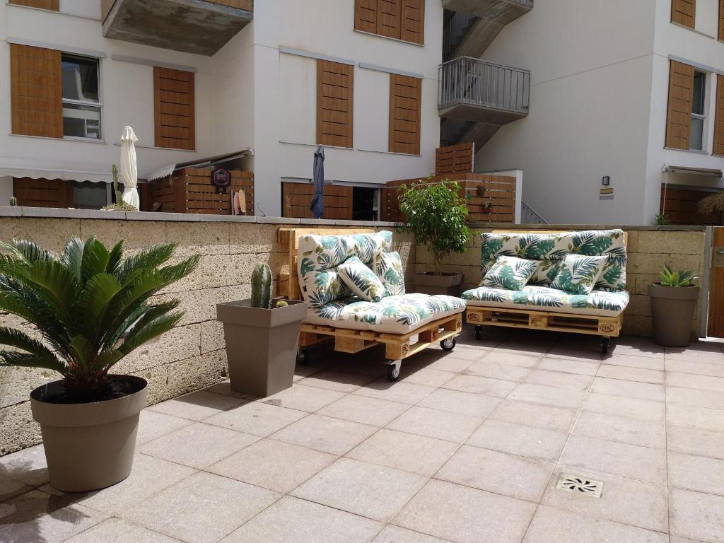 Posezení v ubytování Nuevo y acogedor duplex frente al mar