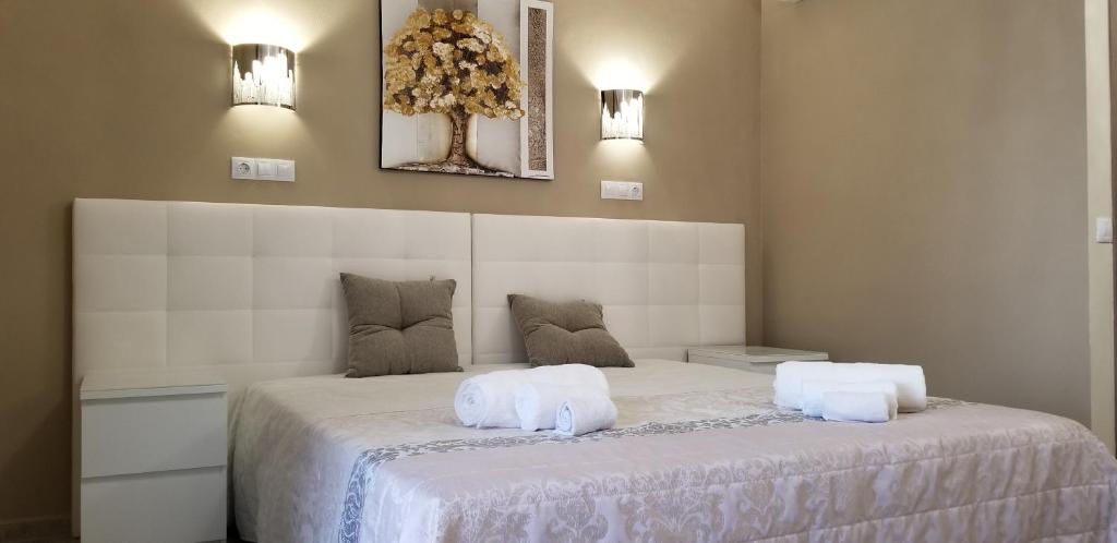A bed or beds in a room at Villa Irena Denia