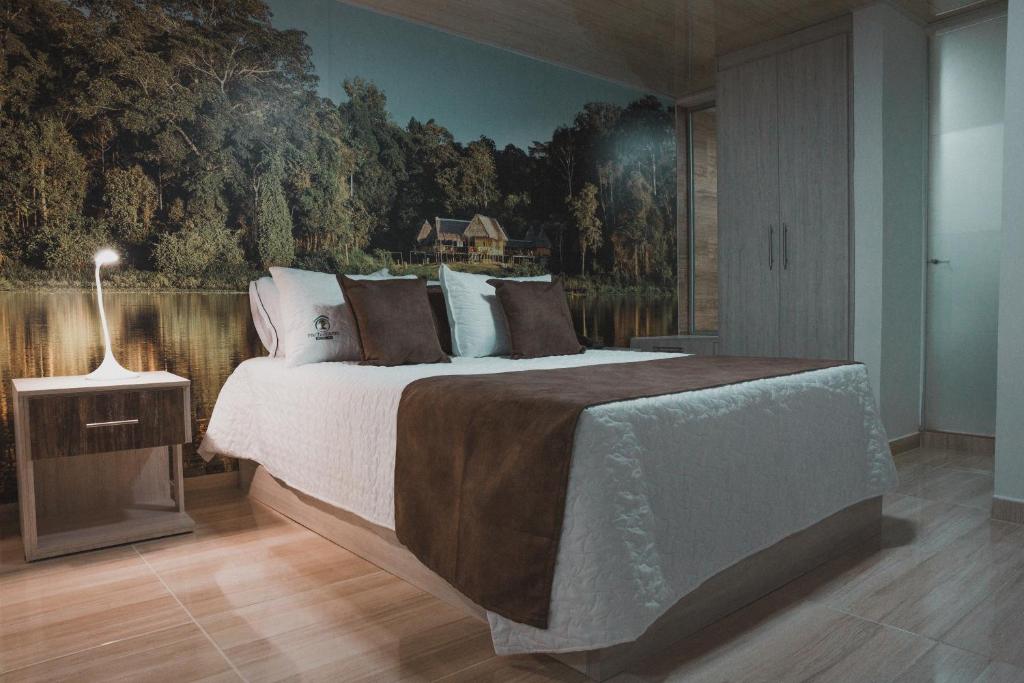 Postel nebo postele na pokoji v ubytování HOTEl PACHAMAMA SPA