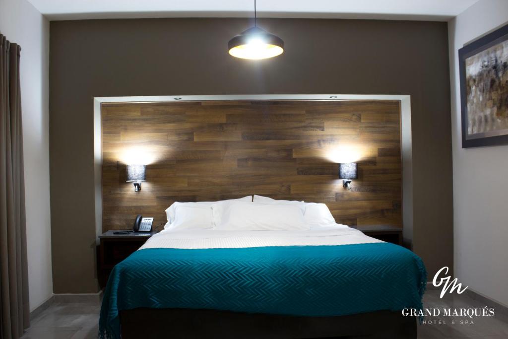 Postel nebo postele na pokoji v ubytování Grand Marques