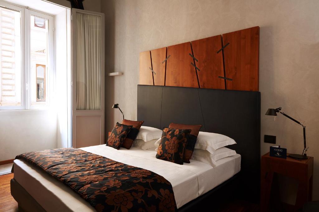 Postel nebo postele na pokoji v ubytování The Code Hotel