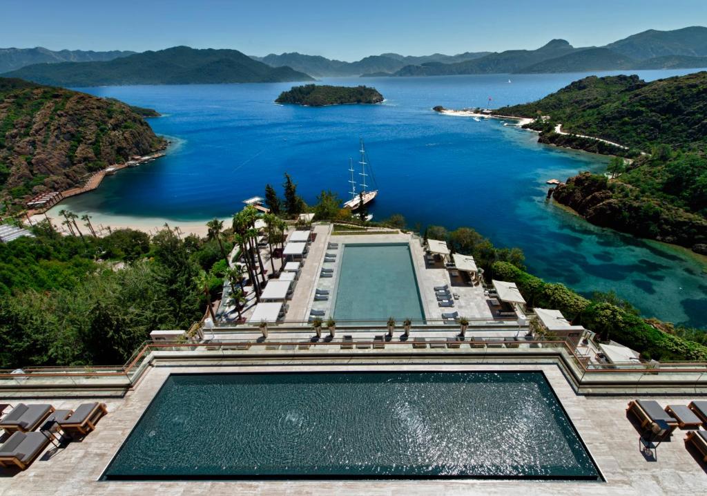 a swimming pool with a view of a body of water at D Maris Bay in Hisarönü