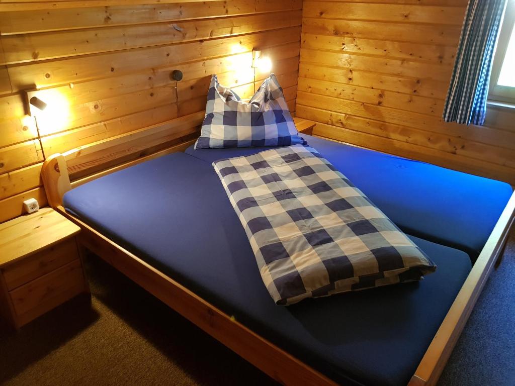 Voodi või voodid majutusasutuse Holzhaus in Hinterstoder toas