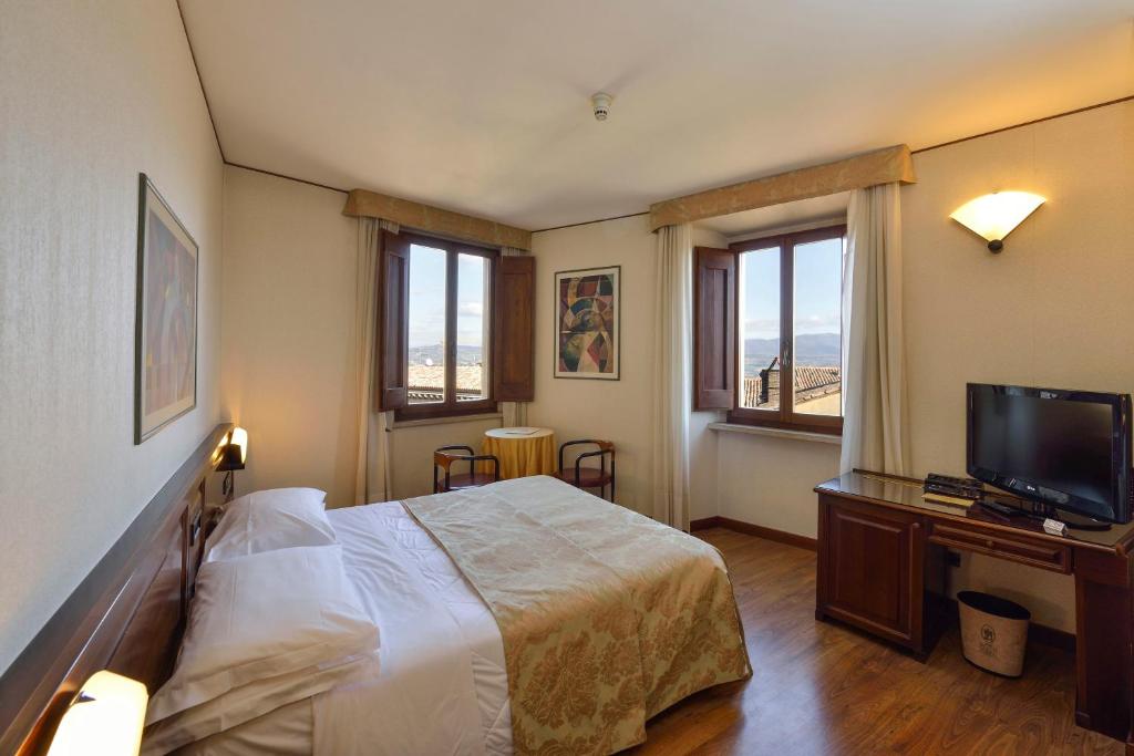 Postel nebo postele na pokoji v ubytování Hotel Fonte Cesia