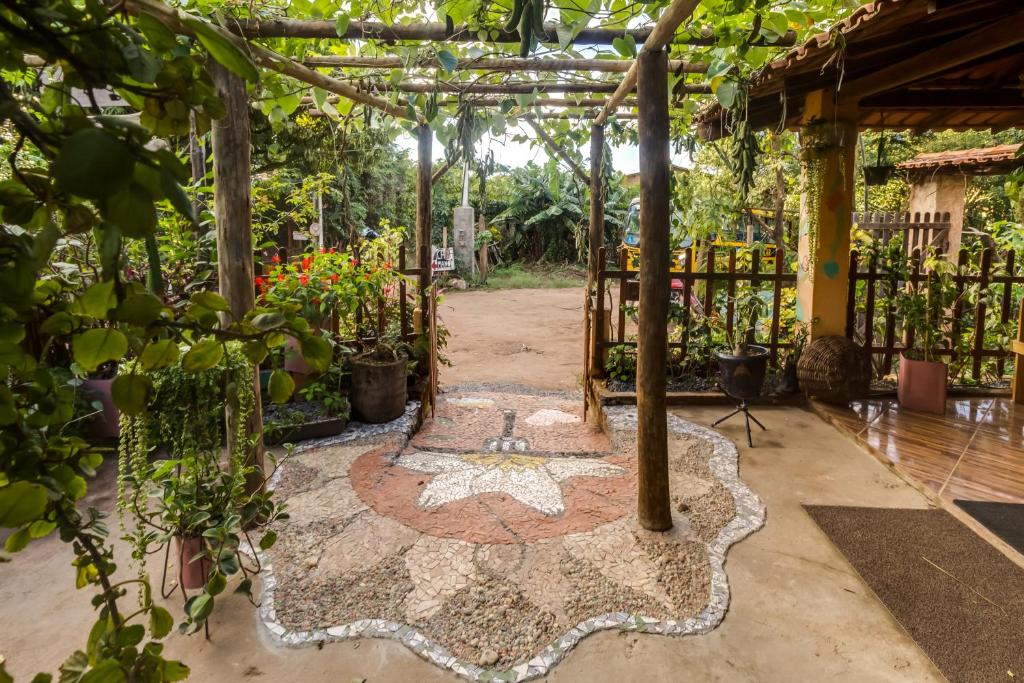 a garden with a rug on a patio at Espaço Matagal in Vale do Capao