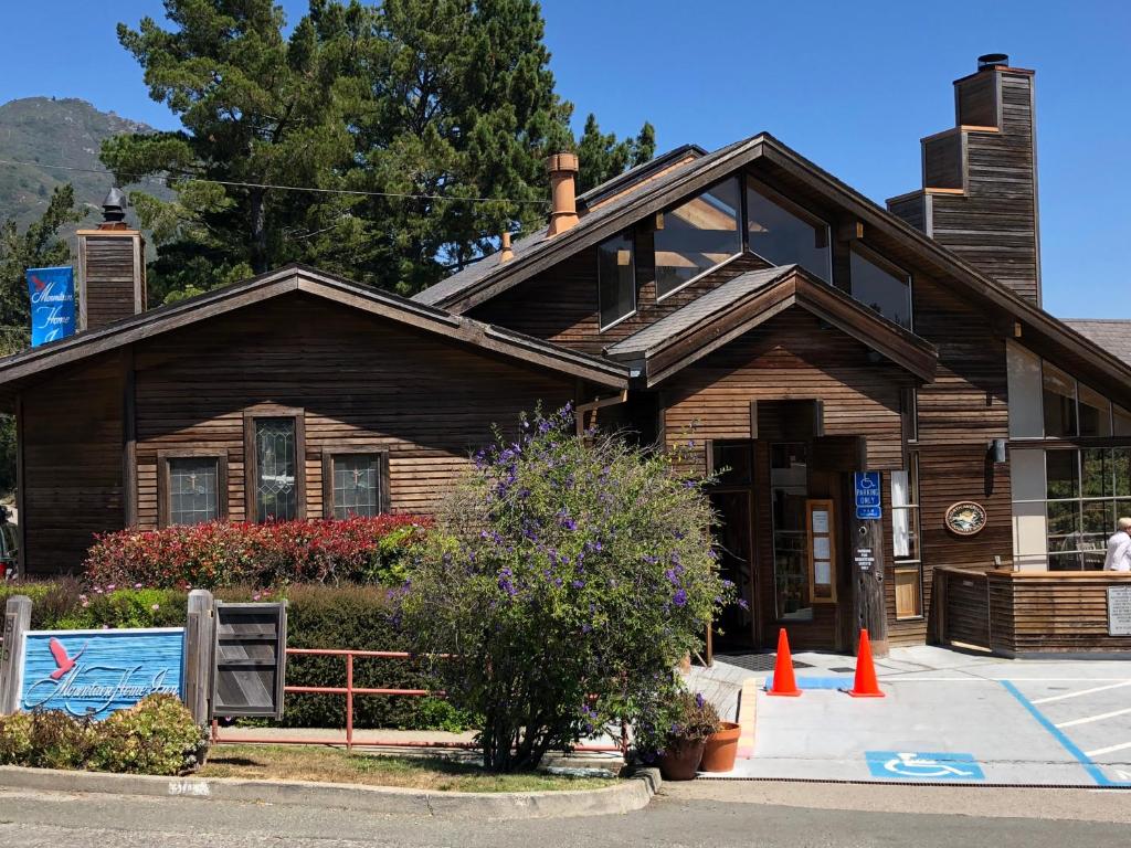 a wooden house with orange cones in front of it at Mountain Home Inn in Mill Valley
