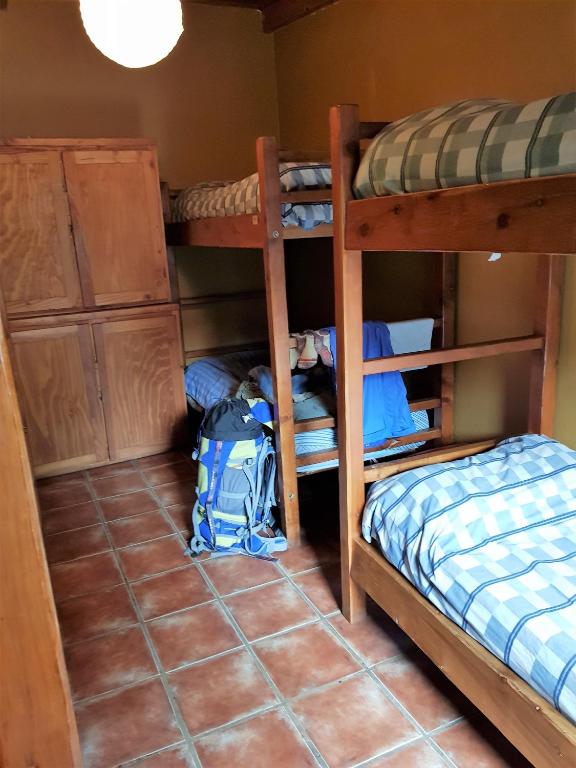 Postel nebo postele na pokoji v ubytování Patagonia Jazz Hostel