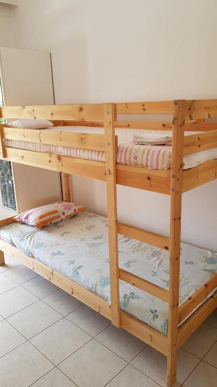 Posteľ alebo postele v izbe v ubytovaní Cosy family apartment near the Sea