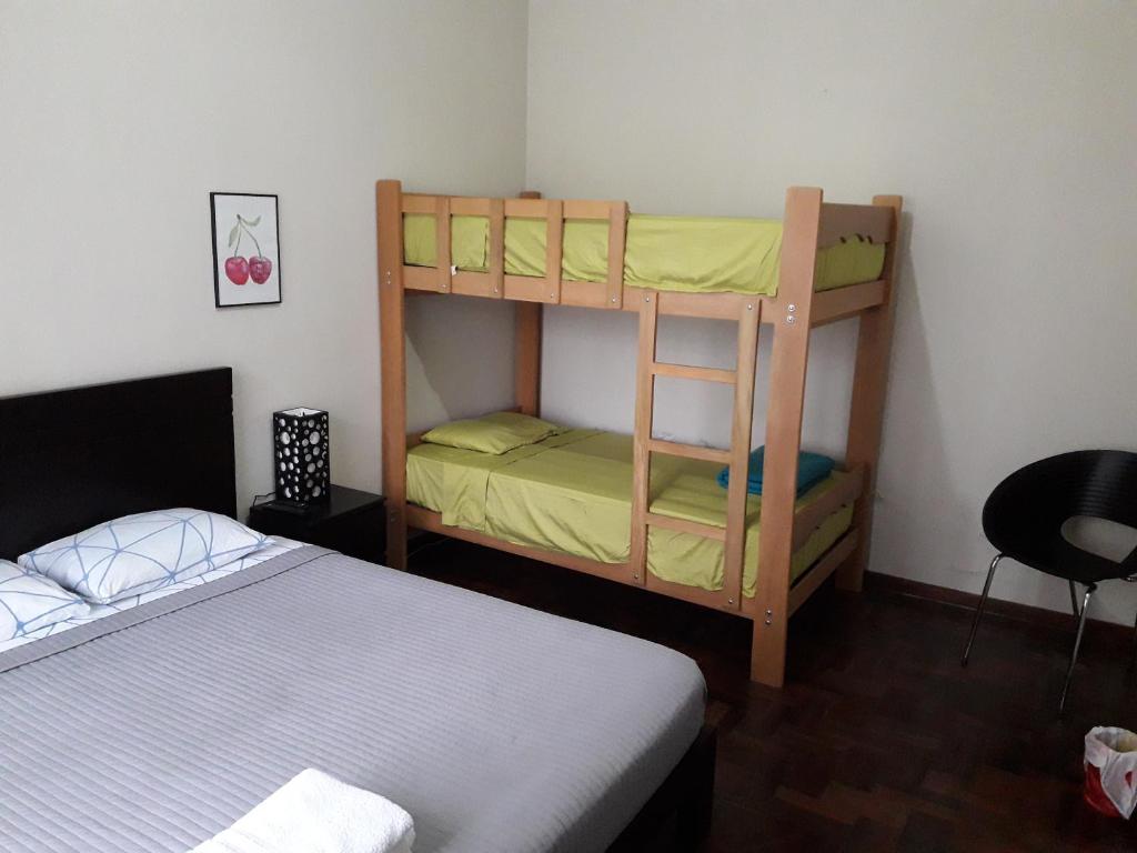Postel nebo postele na pokoji v ubytování Cozy and Comfortable Home in MIRAFLORES