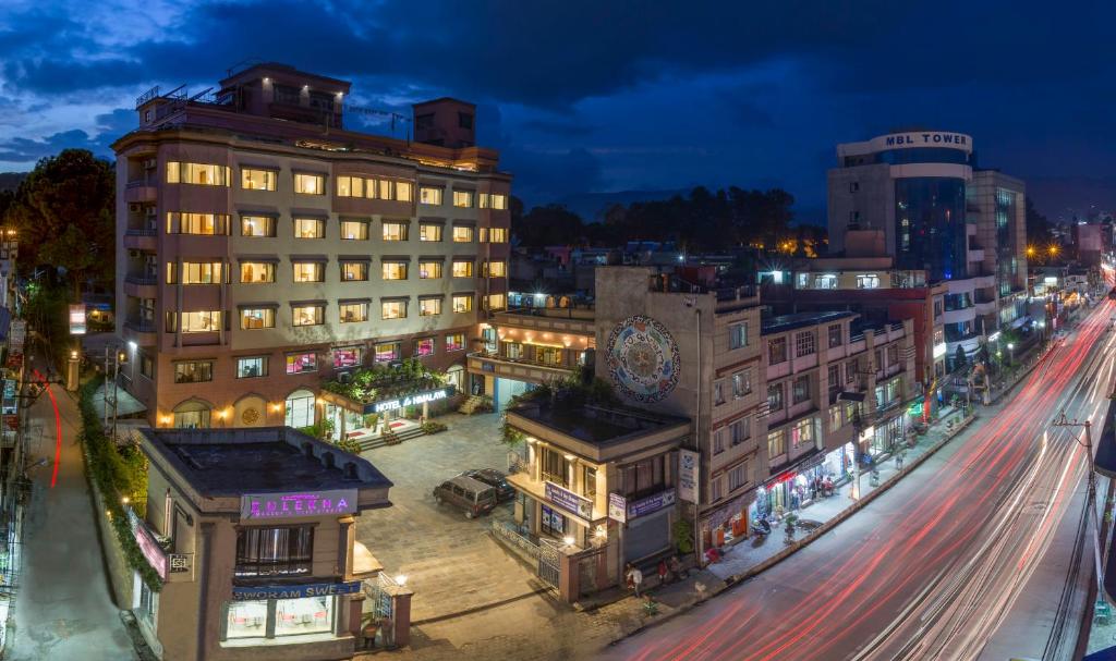 a city at night with traffic on a street at Hotel Le Himalaya by Best Resort Nepal in Kathmandu